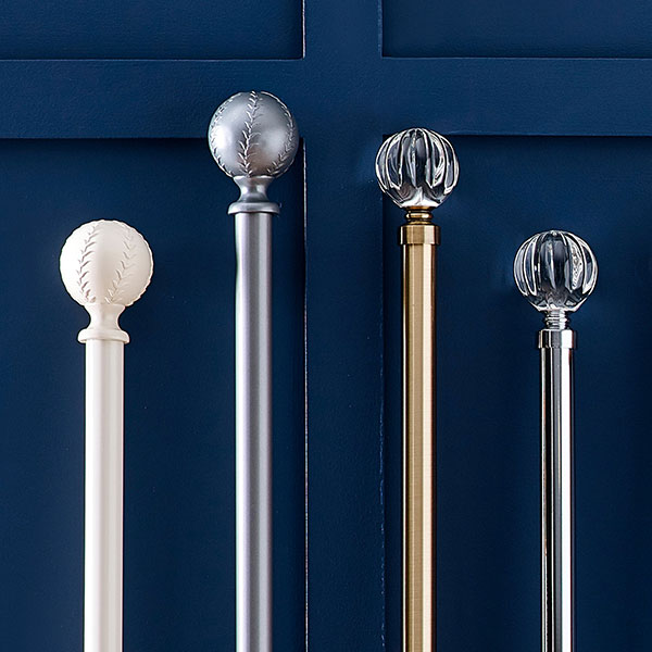 Metallic curtain poles with glass ends