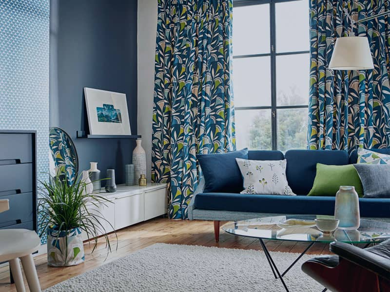 Modern blue curtains and sofa at Shrewsbury house
