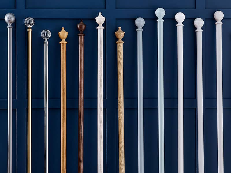 Range of wooden and metal curtain poles